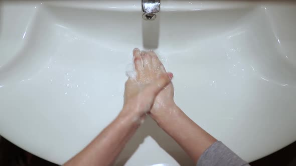 Woman Washing Hands the Best Way at Home