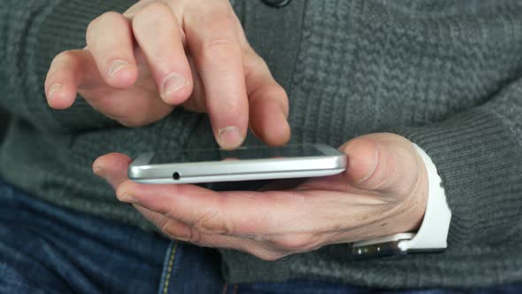 Elderly Man Uses A Tablet