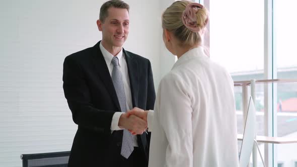 Job Seeker and Manager Handshake in Job Interview