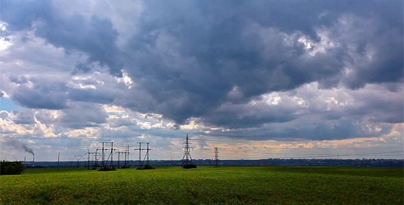 Green Field And Cloudy Sky