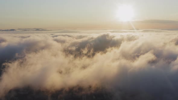 View From a Drone of City Center Above Which Clouds are Rapidly Floating