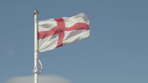 English flag flying on windy day
