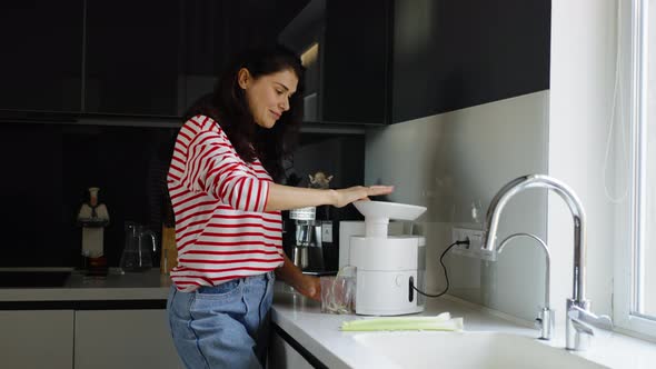 Woman Preparing Celery Juice in Kitchen