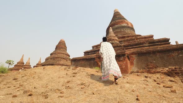 Tourist Woman Walking Along Old Traditional Burmese Temples. Travel Vacation Asian Nature Concept