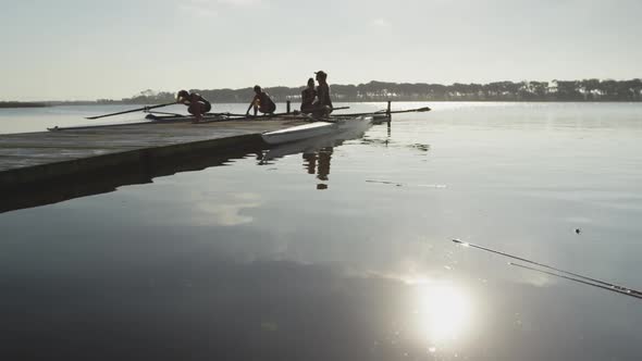 Female rowing team training on a river