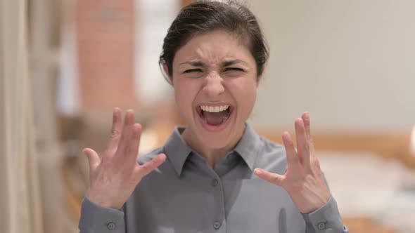 Portrait of Young Indian Woman Screaming, Shouting