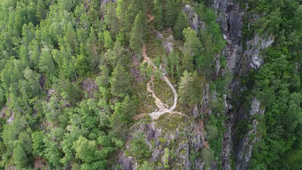 Top-down view of Dangerous Via-Ferrata mountain climbing enroute to mountain Hoven - Trail on cliff