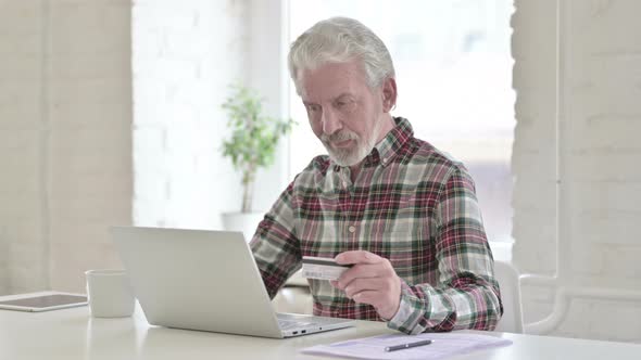Online Payment on Laptop By Old Male Designer