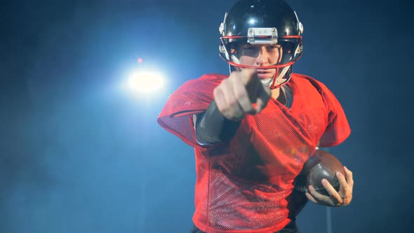 American Football Player Runs on a Light Background, Close Up