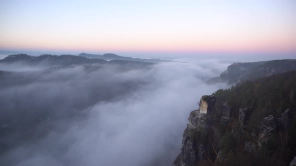 Foggy morning view of famous Bastei national park in saxon switzerland