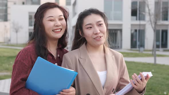 University students talking and having fun together after having classes together