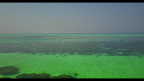 Aerial drone view panorama of tropical shore beach lifestyle by blue sea with white sand background 