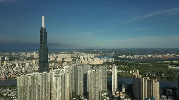 aerial tracking shot from Binh Thanh district looking onto modern developments and across the Saigon