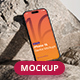 iPhone 16 Compatible Mockup on Rocks - GraphicRiver Item for Sale