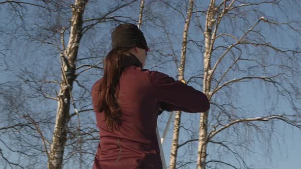 Female Skier Standing Outdoors