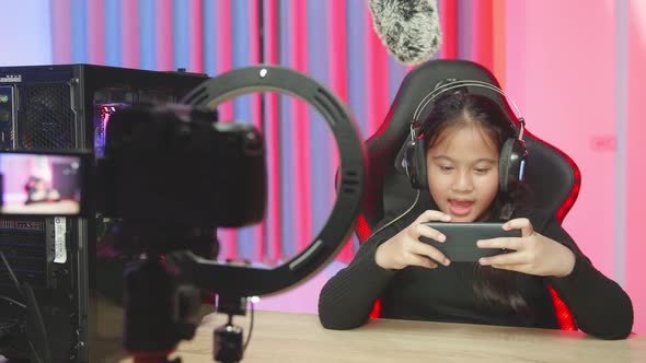 Streamer Cute Girl Is Playing A Game On Her Smartphone And Feeling Relax