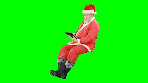 Santa claus using digital tablet