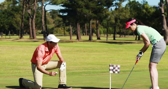 Two golfer players playing golf together