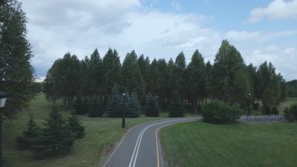 Flight over the city park. A winding bike path is visible below.