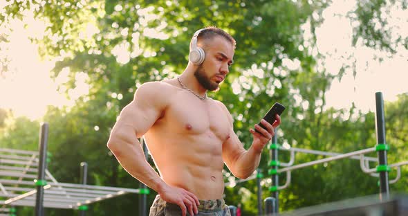 Sporty Man Preparing for Exercising Outdoor in Summer