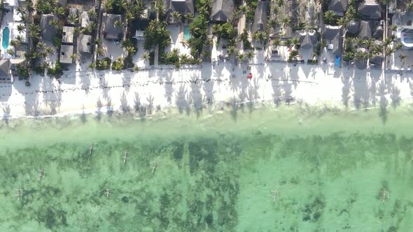 Vertical Video of the Ocean Near the Coast of Zanzibar Tanzania Aerial View