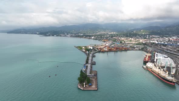 Aerial view of beautiful Batumi coastline. Black Sea touristic dock, Batumi port, harbor and bay