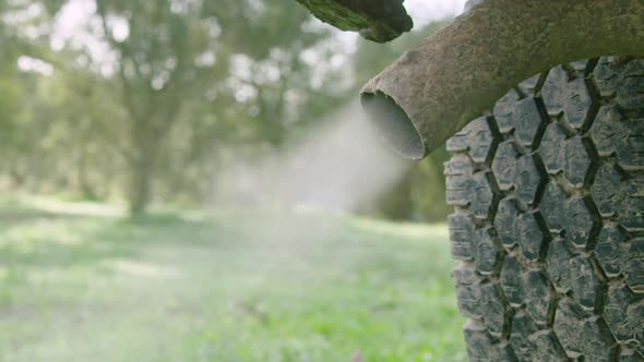 CU old car exhaust as the engine starts releasing dirty fumes