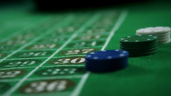 Casino chips and dice on roulette in casino