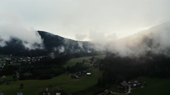 Panoramic View of a Picturesque Mountain Valley with a Village in a Lowland