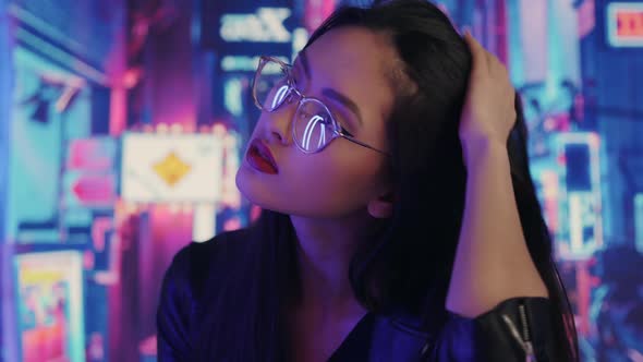 Asian Woman in the City at Night.