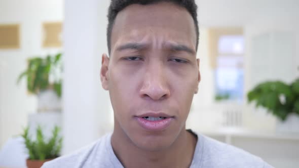 Angry African Young Man Yelling in Office