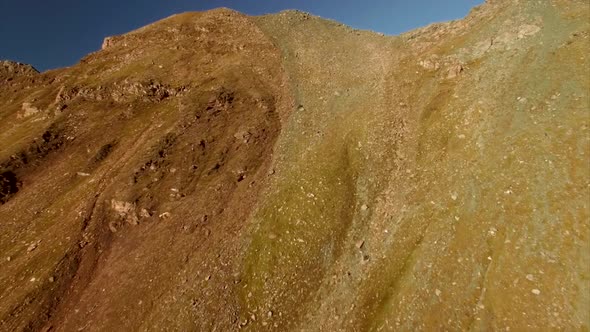 Climbing up by the mountain slope in the Alps