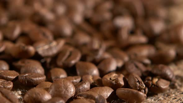 Coffee Beans on Burlap Sacking Background, Rotation, Close Up