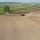 Agriculture Tractor Working and Cultivating Field in Farmland. - VideoHive Item for Sale