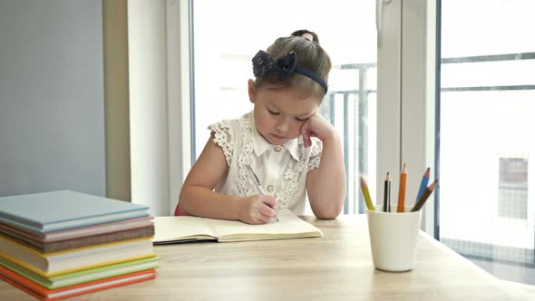 Little Elementary Schoolgirl Doing Homework