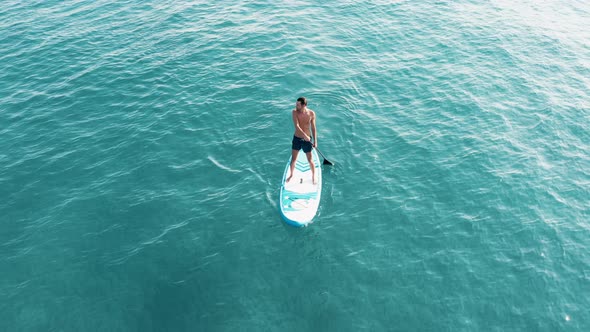 Surfing On A Paddle Sup Borad