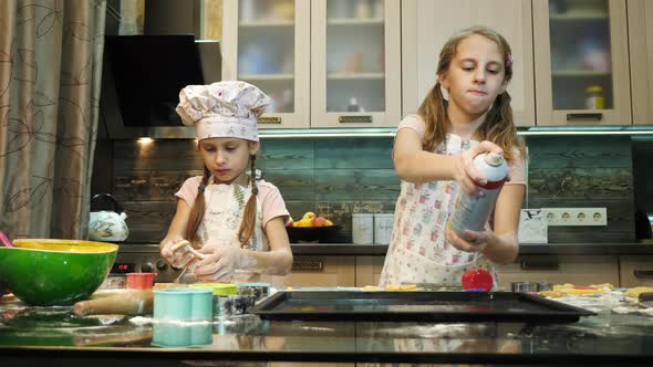 Girl spraying the baking pan