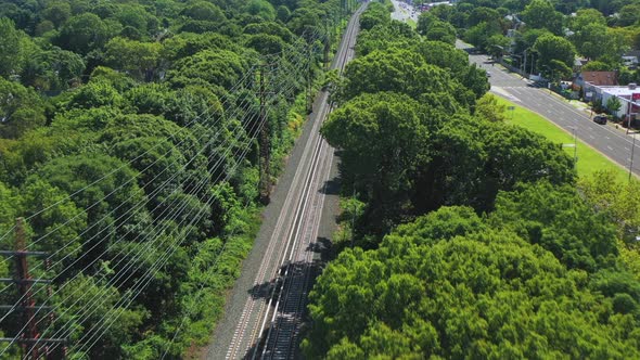 flight over Long Island Railroad tracks, trees and Sunrise Highway in Rockville Centre, New York