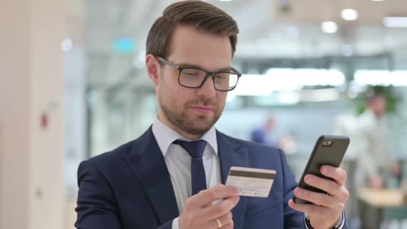 Online Payment Success on Smartphone By Businessman