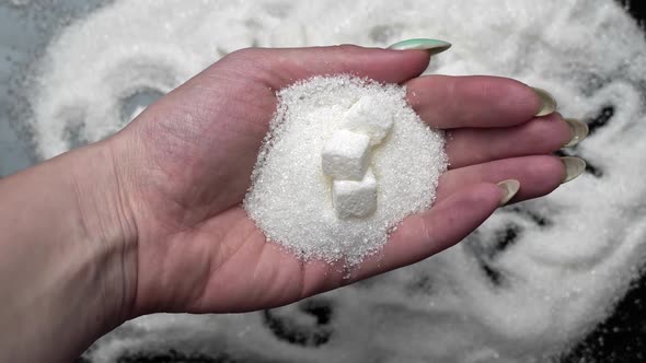 Sugar in a Woman's Hand As a Symbol of Harm to the Heart