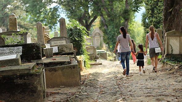 Little Girl Walking in Cemetery