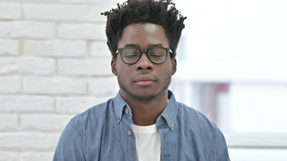 Young African Man Looking at Camera