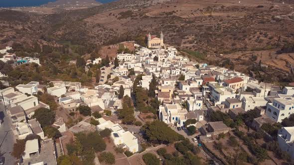 Aerial Drone Shot Slowly Pulling Back Revealing the Island Village of Lefkes Greece