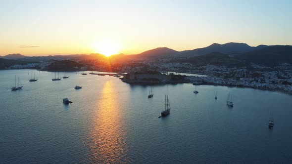 Bodrum Bay and Anceint Castle of Saint Peter at the Sunset. Yachts Moored in the Bay of Resort Town