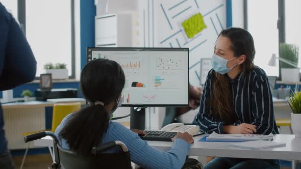 Freelancers Wearing Protective Face Masks Working on Computer