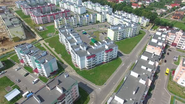 new modern quarter with high rise buildings on the background of the urban view. Aerial view