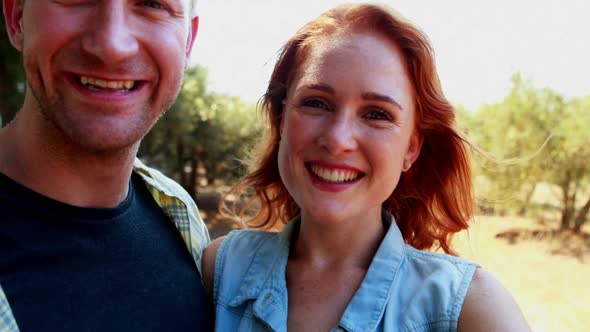 Portrait of happy couple showing engagement ring 4k