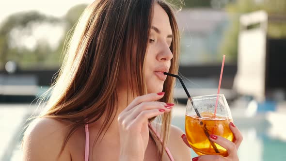Beautiful Young Woman Drinking Cocktail Closeup