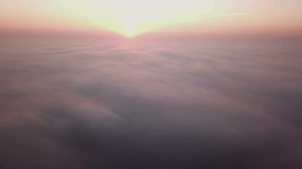 Beautiful Misty Dawn. Flying Above the Clouds