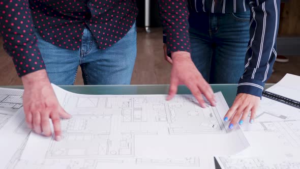 Hald Held Footage of Architects Working with Blue Prints